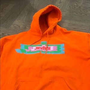 Vibrant Orange Hoodie with Graphic Design